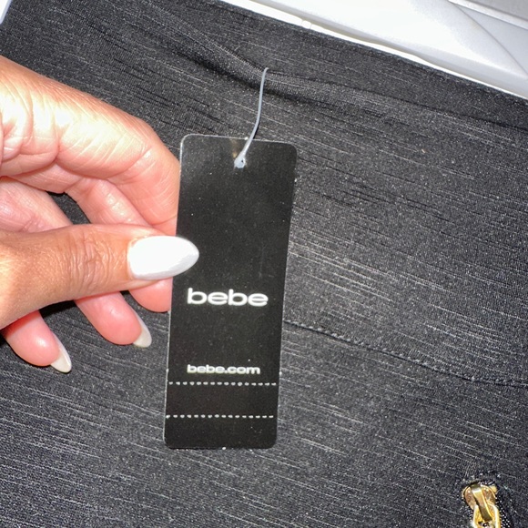 Size small black stretchy skirt with slit in back - Picture 2 of 4